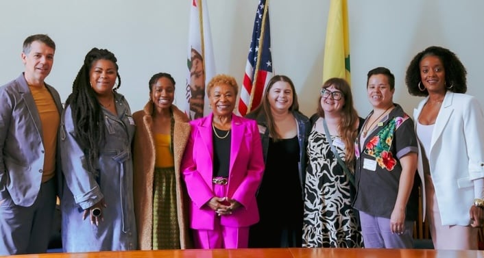 Mayor Barbara Lee and group posing for a picture.